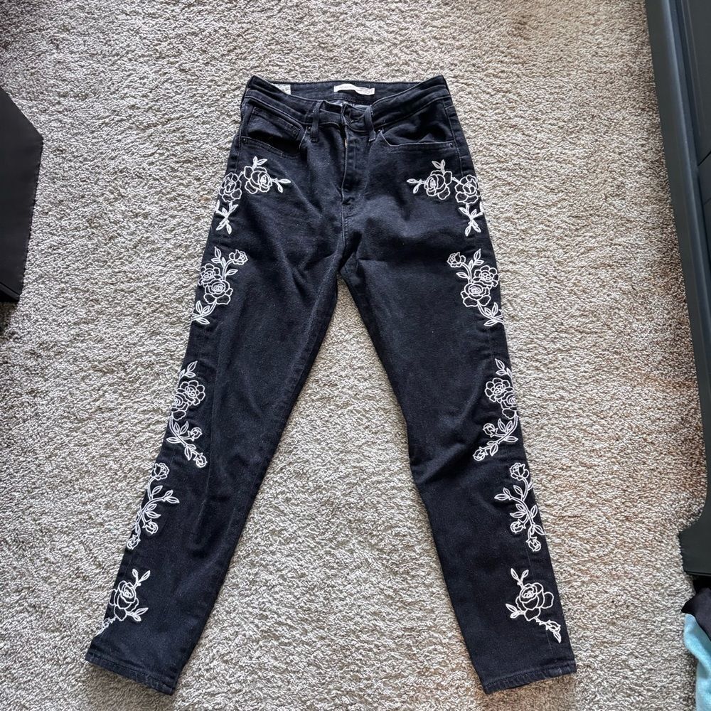 LEVI’s high rise jeans with embroidered leg flower pattern size 27